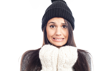 Image showing pretty brunette woman with a woolen hat a sweater and gloves tha