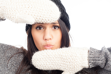 Image showing pretty brunette woman with a woolen hat a sweater and gloves smi