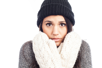 Image showing pretty brunette woman with a woolen hat a sweater and gloves tha