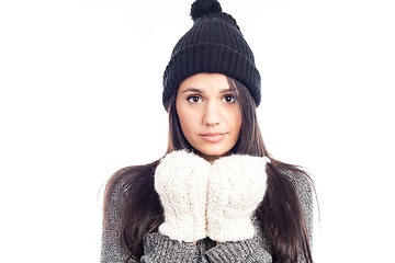 Image showing pretty brunette woman with a woolen hat a sweater and gloves tha