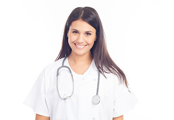 Image showing portrait of smiling nurse or brunette doctor in white coat with 
