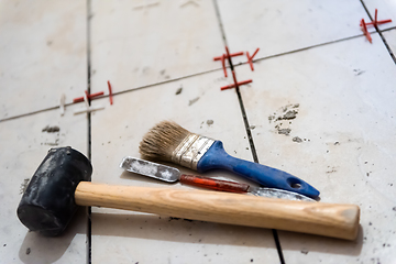 Image showing Ceramic tiles and tools for tiler