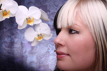 Image showing Woman and orchid