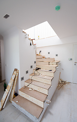 Image showing work in progress on stylish interior with wooden stairs