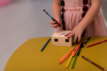 Image showing little girl painting jewelry box