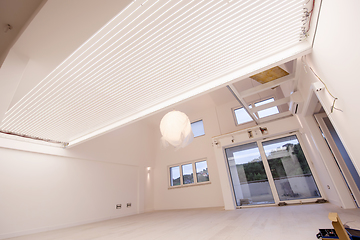 Image showing Interior of empty stylish modern open space two level apartment