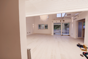 Image showing Interior of empty stylish modern open space two level apartment