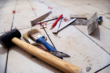 Image showing Ceramic tiles and tools for tiler