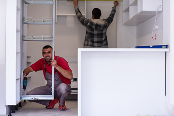 Image showing workers installing a new kitchen