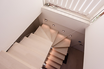 Image showing stylish interior with wooden stairs