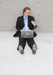 Image showing businessman sitting