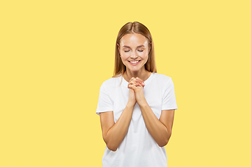 Image showing Caucasian young woman\'s half-length portrait on yellow background