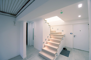 Image showing stylish interior with wooden stairs