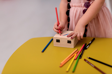 Image showing little girl painting jewelry box