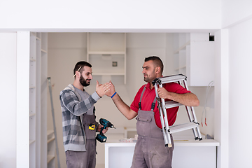 Image showing workers giving high five to each other