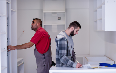 Image showing workers installing a new kitchen