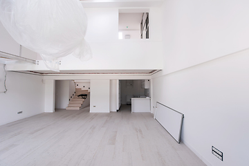 Image showing Interior of empty stylish modern open space two level apartment