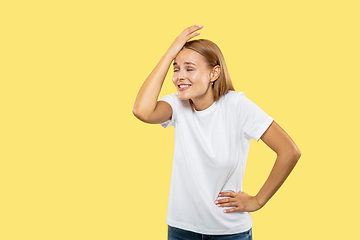 Image showing Caucasian young woman\'s half-length portrait on yellow background