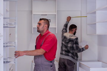 Image showing workers installing a new kitchen