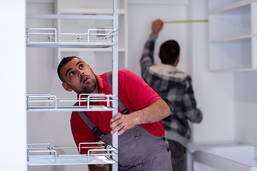 Image showing workers installing a new kitchen