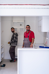 Image showing workers installing a new kitchen