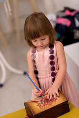 Image showing little girl painting jewelry box
