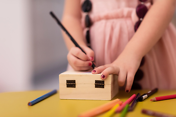 Image showing little girl painting jewelry box