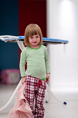 Image showing portrait of cute little girl playing at home