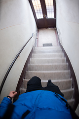 Image showing man opening door of a building