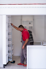 Image showing workers installing a new kitchen