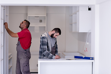 Image showing workers installing a new kitchen