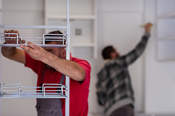 Image showing workers installing a new kitchen