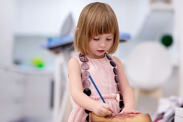 Image showing little girl painting jewelry box