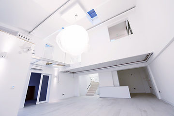 Image showing Interior of empty stylish modern open space two level apartment