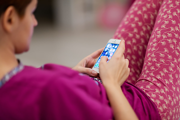 Image showing woman using mobile phone at home