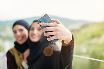 Image showing muslim women taking selfie picture on the balcony