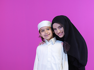 Image showing portrait of muslim mother and son on pink background