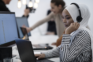 Image showing African businesswoman wearing headset in helpdesk