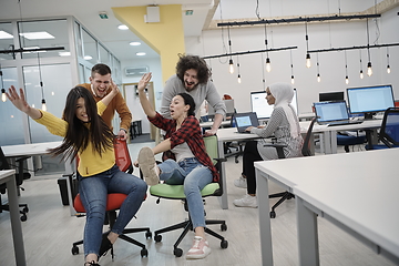 Image showing racing on office chairs