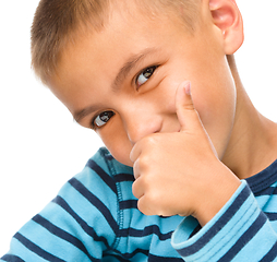 Image showing Little boy is showing thumb up sign