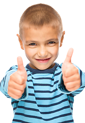 Image showing Portrait of a cute boy showing thumb up sign