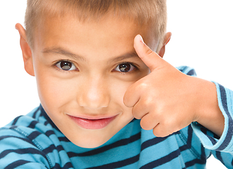 Image showing Little boy is showing thumb up sign