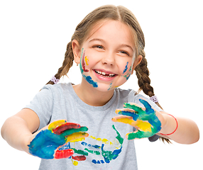 Image showing Portrait of a cute girl playing with paints