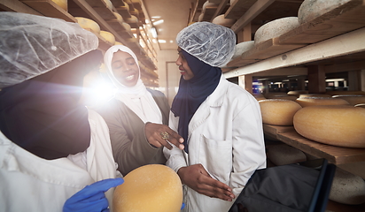 Image showing business woman team in local cheese production company