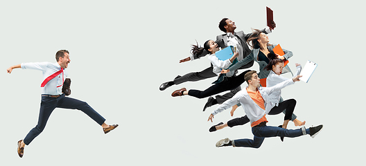 Image showing Office worker s or ballet dancers jumping on white background