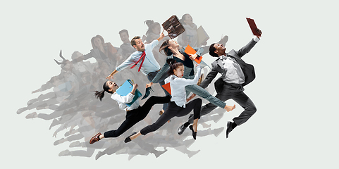 Image showing Office worker s or ballet dancers jumping on white background