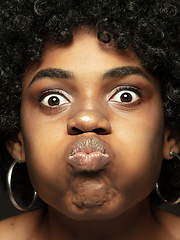 Image showing Close up portrait of young african-american emotional girl