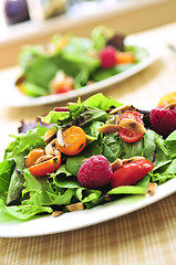 Image showing Green salad with berries and tomatoes