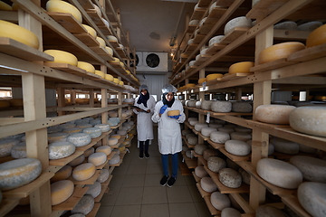 Image showing business woman team in local cheese production company