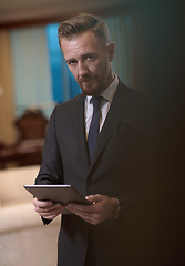 Image showing business man using tablet computer